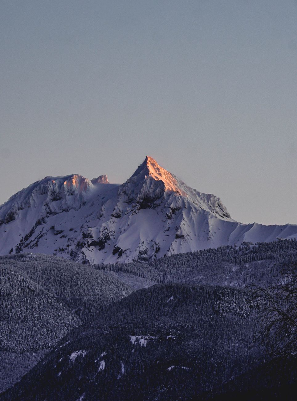 snow covered mountains under the sky