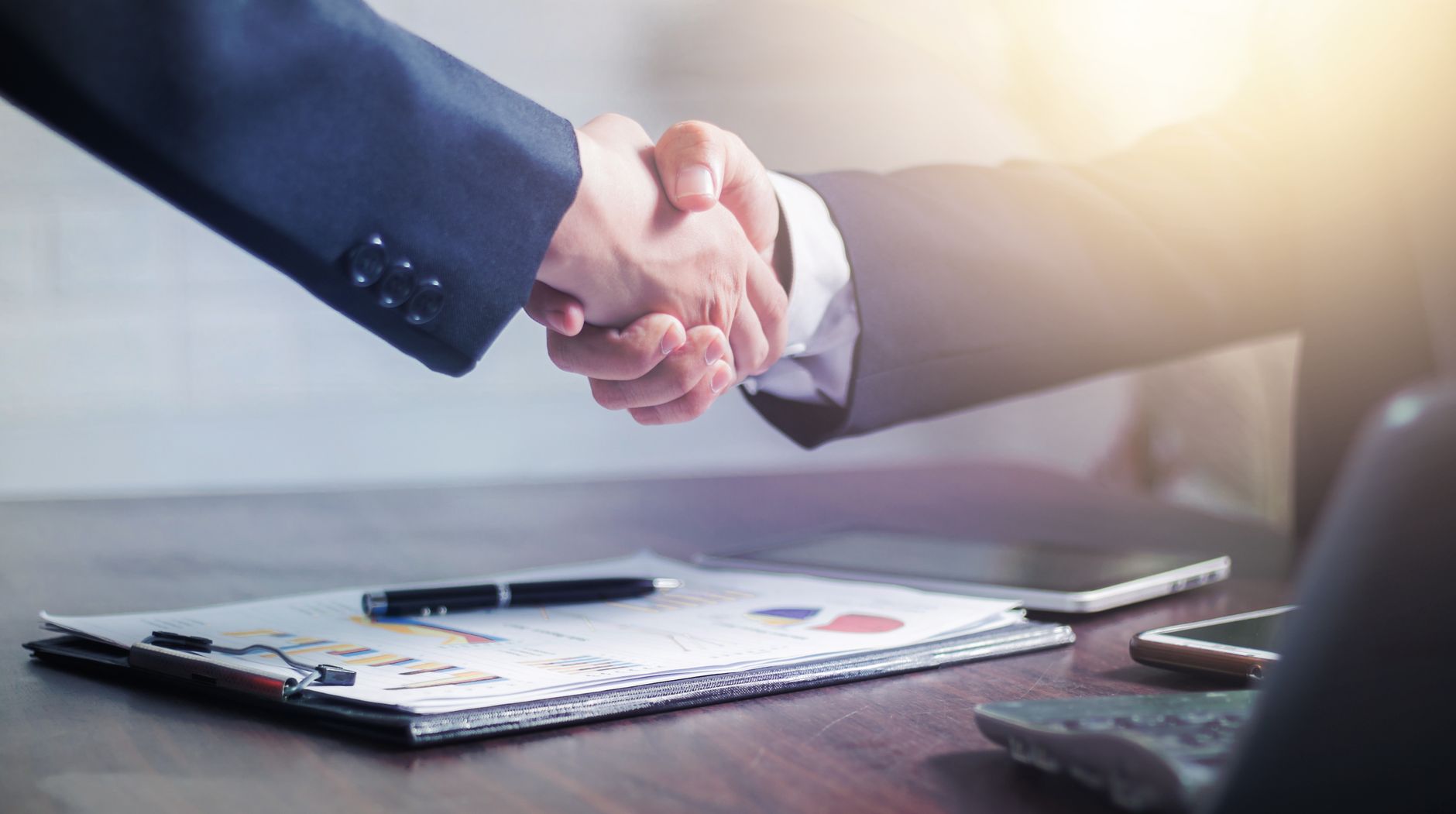 two men making a handshake