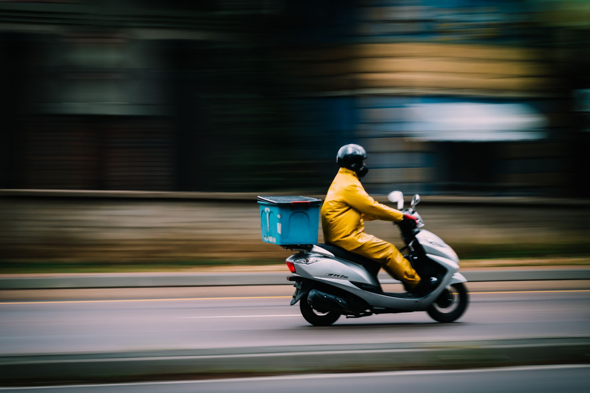 man in yellow clothes riding motorcycle