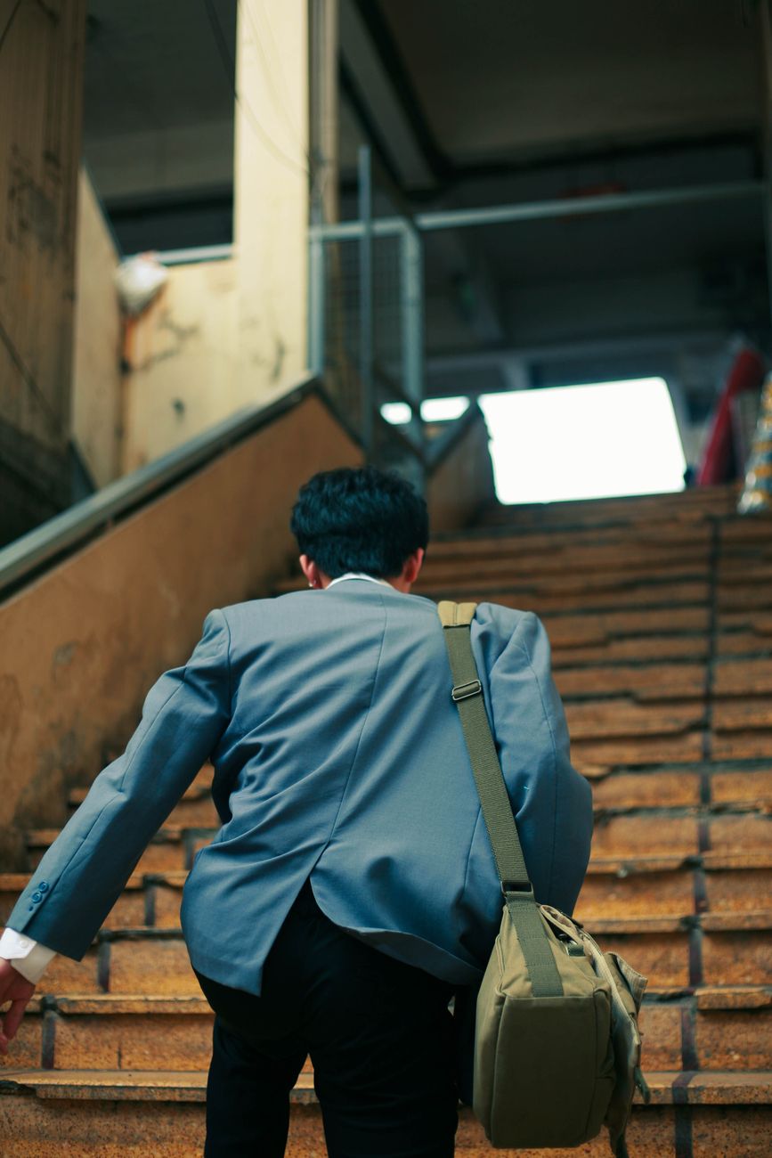 man walking upstairs